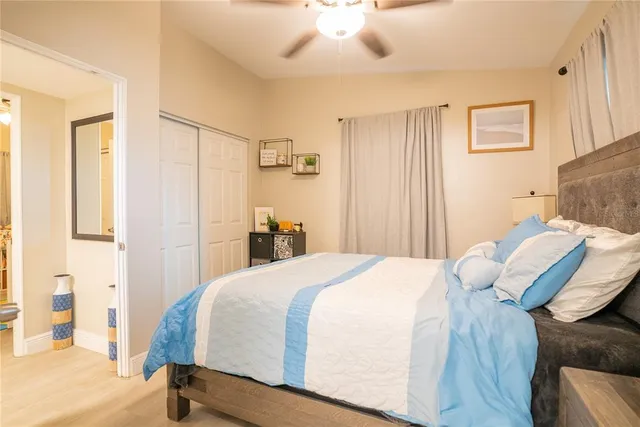 a bedroom with a bed and closet