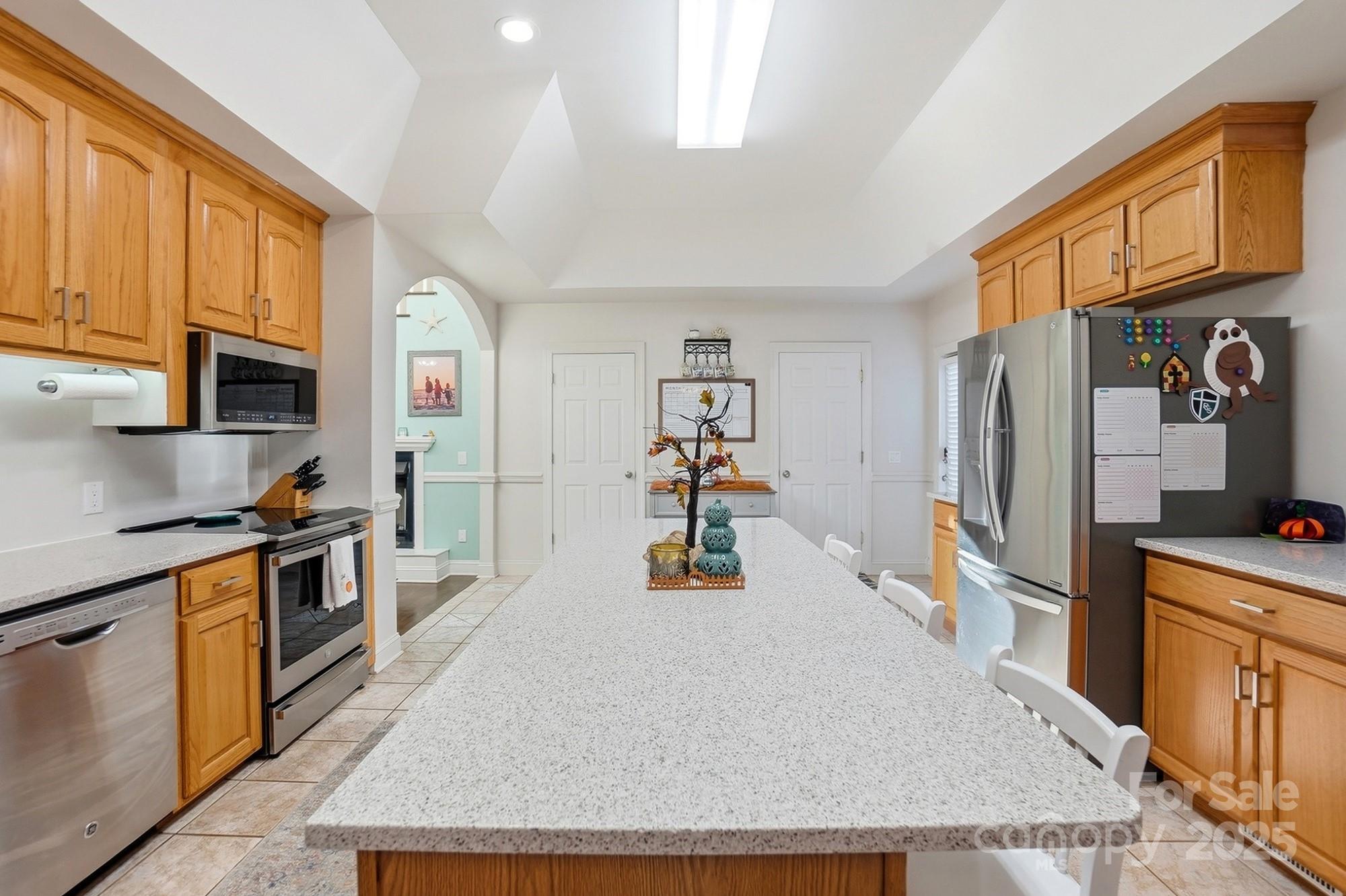 845 St Paul Church Road Salisbury, NC 28146 - Photo 14 of 44 a kitchen with stainless steel appliances granite countertop a refrigerator a stove top oven a sink and dishwasher