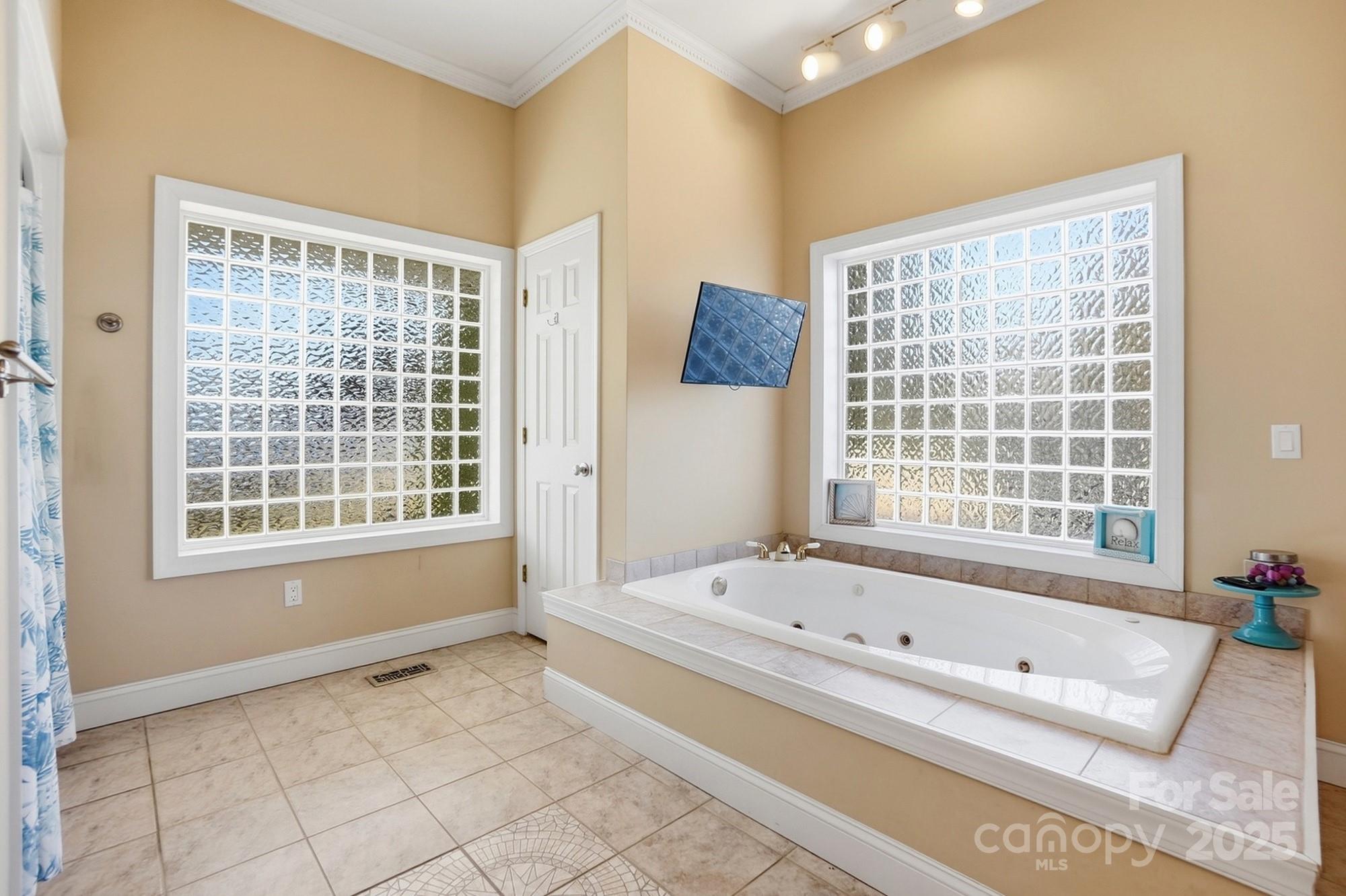 845 St Paul Church Road Salisbury, NC 28146 - Photo 31 of 44 a bathroom with a bathtub and a shower