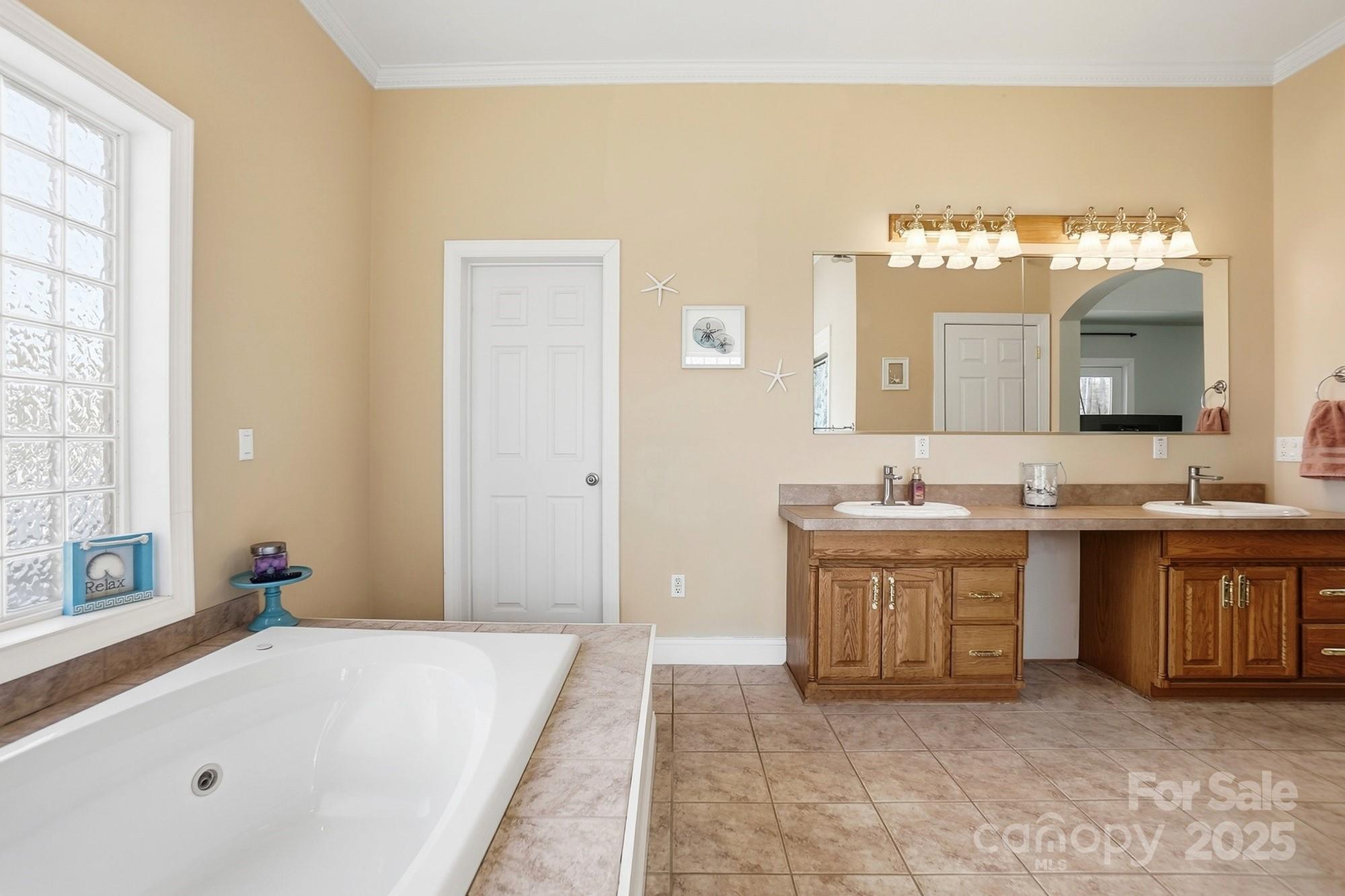 845 St Paul Church Road Salisbury, NC 28146 - Photo 33 of 44 a spacious bathroom with a tub sink and mirror
