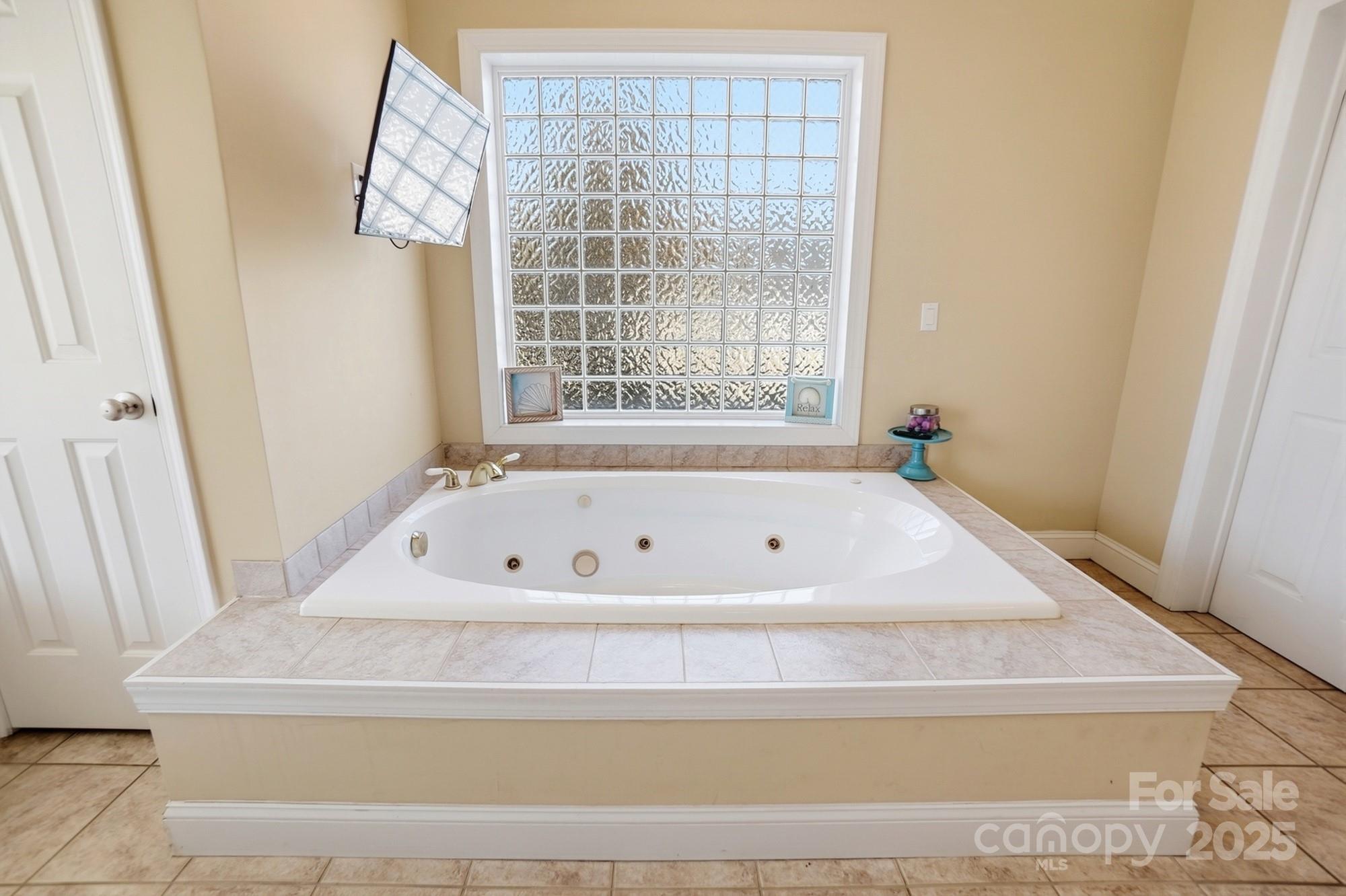 845 St Paul Church Road Salisbury, NC 28146 - Photo 34 of 44 a bath tub sitting in a bathroom next to a window