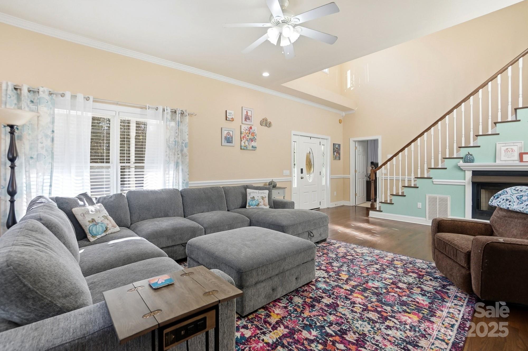 845 St Paul Church Road Salisbury, NC 28146 - Photo 6 of 44 a living room with furniture a rug and a chandelier