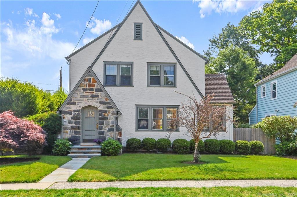 109 Woodmere Road Stamford, CT 06905 - Photo 1 of 1 a front view of a house with a yard