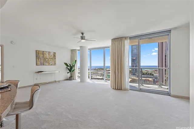 a view of a livingroom with furniture and windows