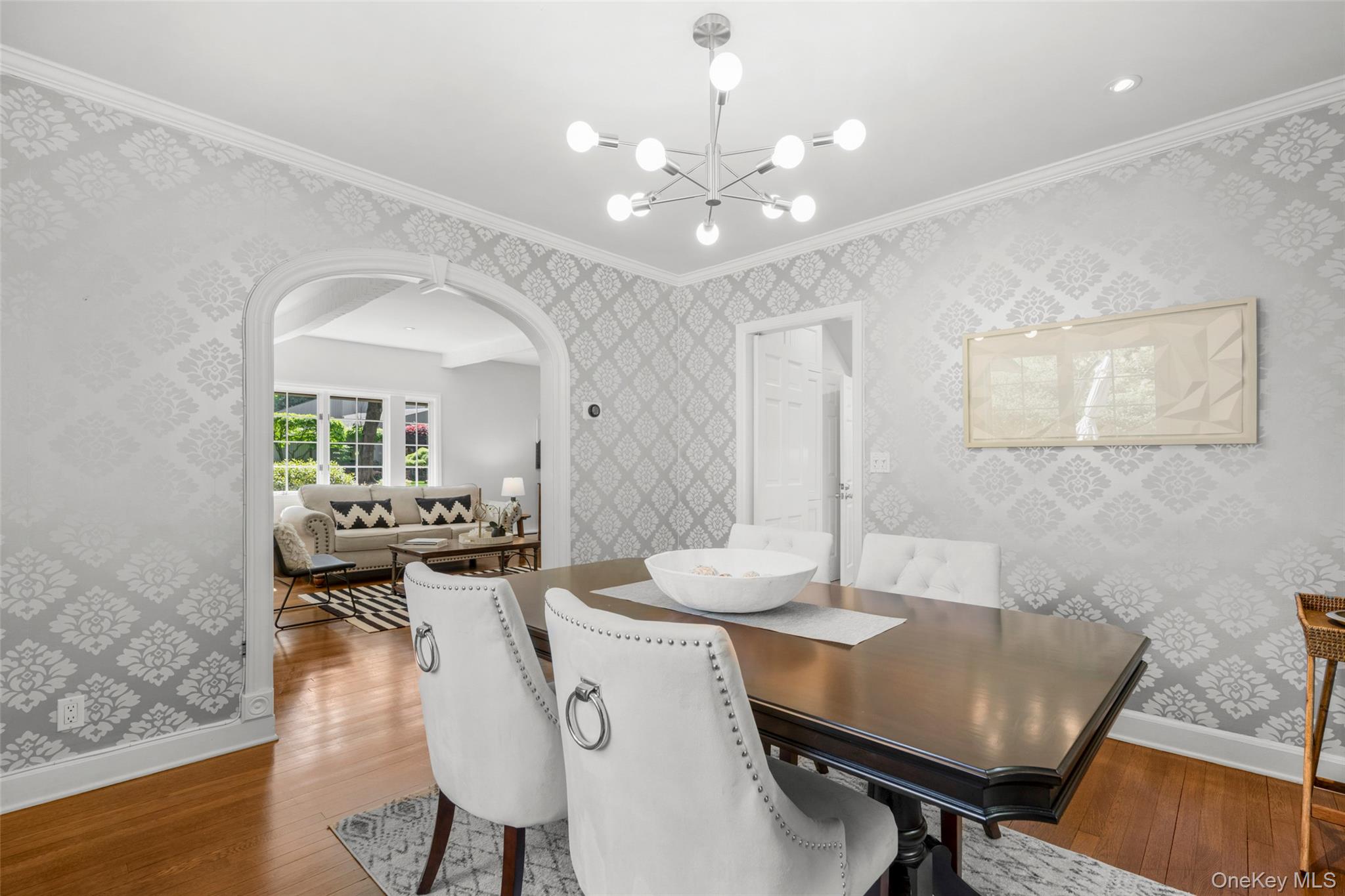 63 Rye Road Rye, NY 10580 - Photo 9 of 50 Formal dining room with elegant arched opening and seamless flow to through the butler's door.