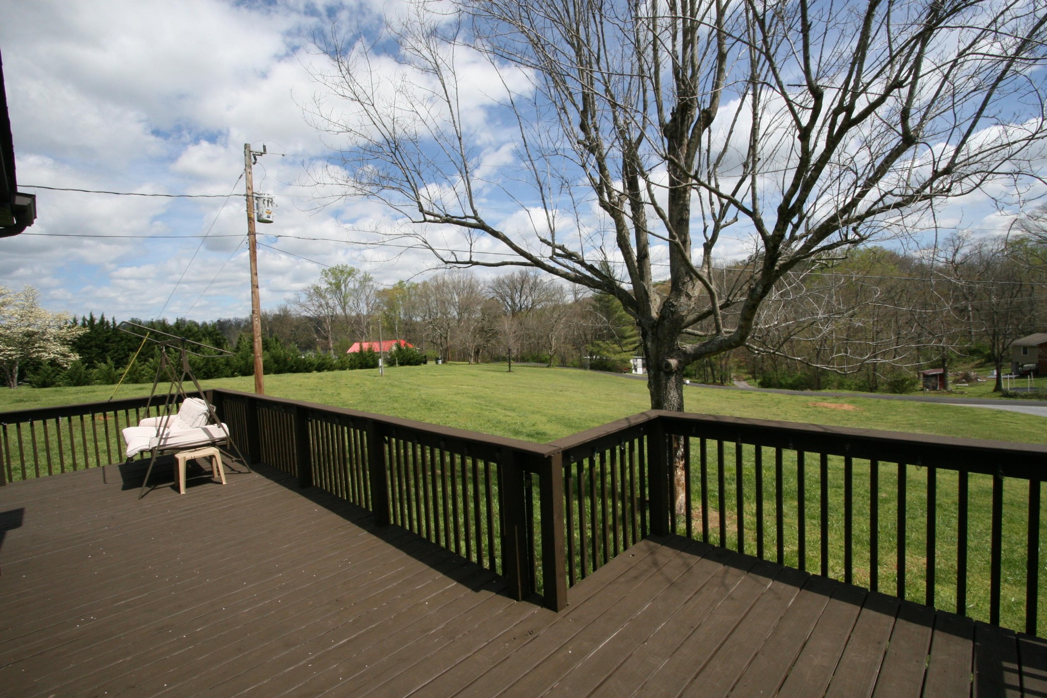 209 South Springview Road Maryville, TN 37801 - Photo 22 of 40 a view of a street with a bench and trees