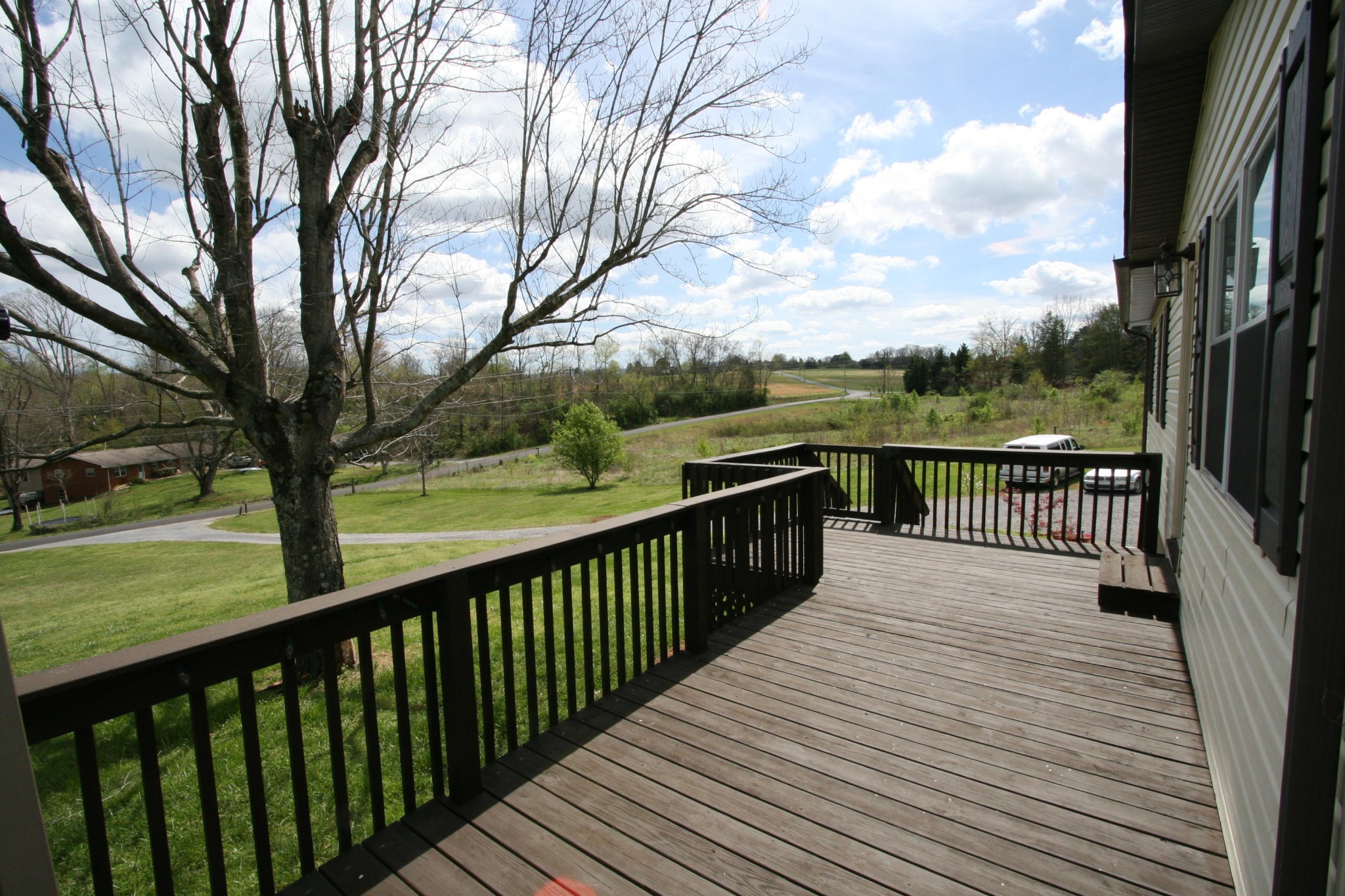 209 South Springview Road Maryville, TN 37801 - Photo 6 of 40 a view of a balcony with wooden floor and fence