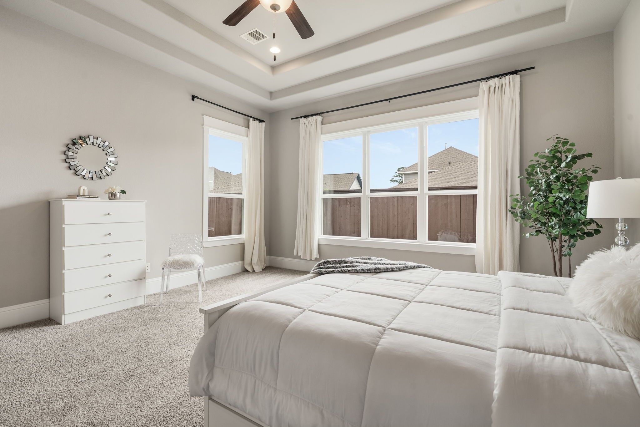 2206 Rope Maker Road Conroe, TX 77384 - Photo 31 of 42 View of the oversized primary bedroom with serene backyard views looking from the ensuite bath.