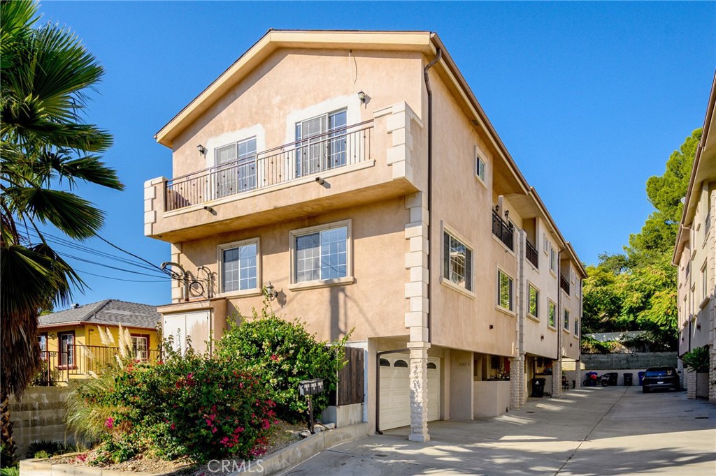 6831 Valmont Street, Unit 1 Tujunga, CA 91042 - Photo 1 of 30 a front view of a building with a street