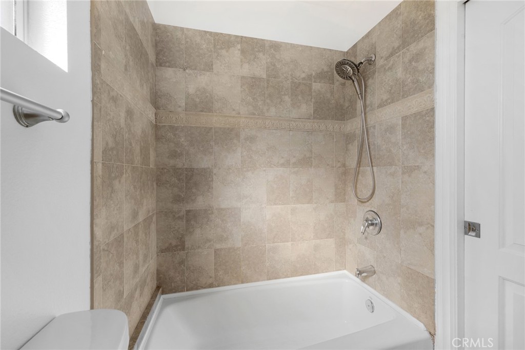 6831 Valmont Street, Unit 1 Tujunga, CA 91042 - Photo 18 of 30 a bathroom with a shower and a toilet