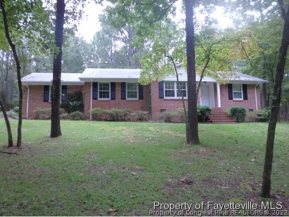400 Myra Road Raeford, NC 28376 - Photo 24 of 24 a front view of a house with garden