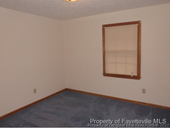400 Myra Road Raeford, NC 28376 - Photo 4 of 24 an empty room with a window