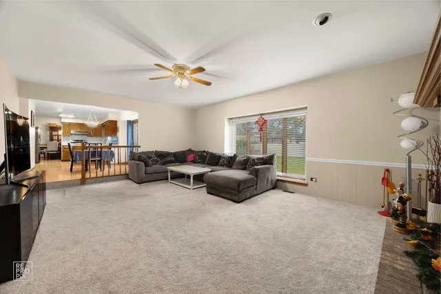 a living room with furniture a couch and a dining table