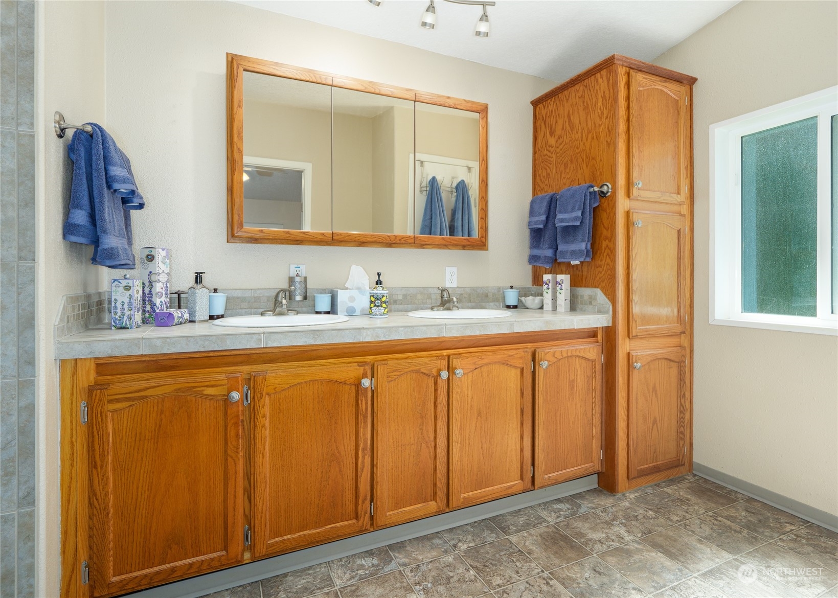74 Miles Road Port Angeles, WA 98362 - Photo 19 of 40 a bathroom with a sink and a mirror