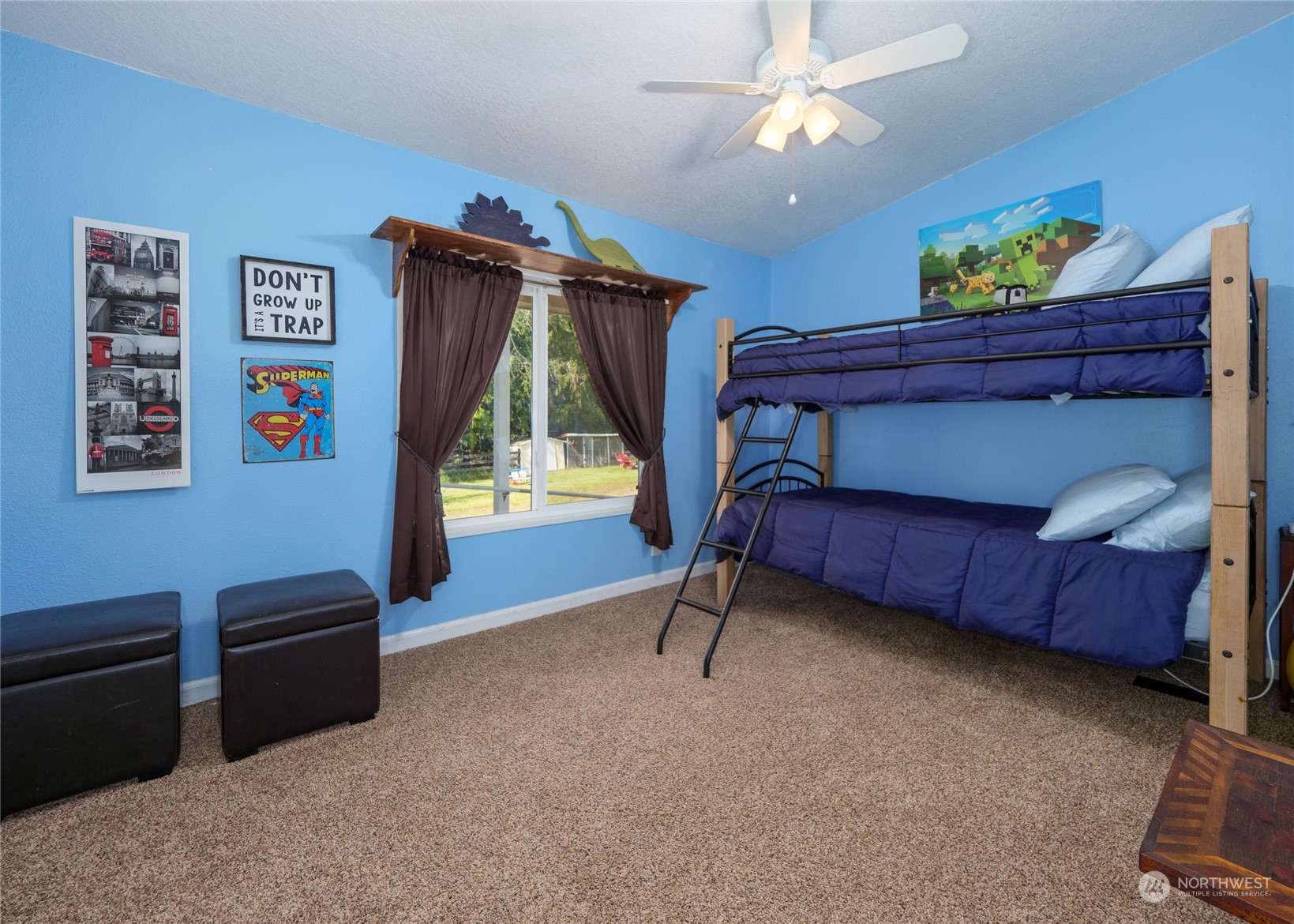 74 Miles Road Port Angeles, WA 98362 - Photo 20 of 40 a bedroom with a bed and a chandelier
