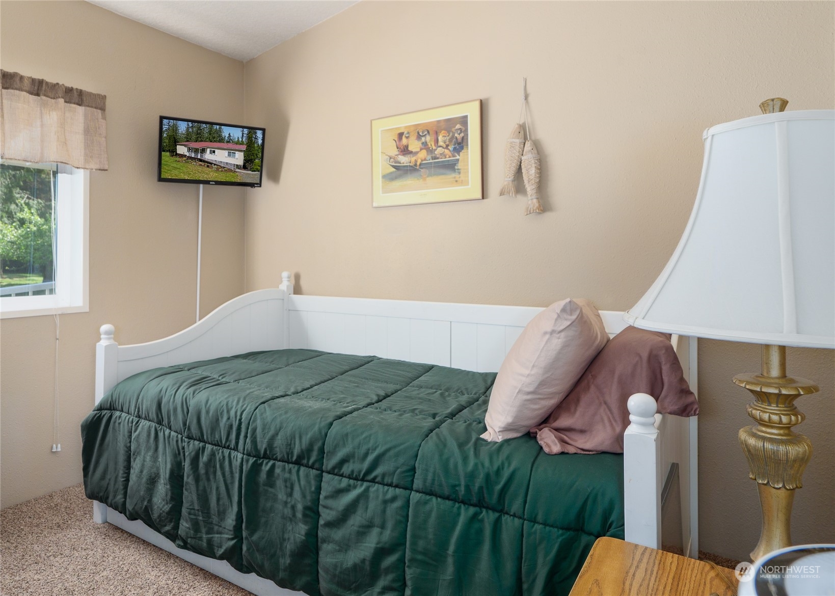 74 Miles Road Port Angeles, WA 98362 - Photo 22 of 40 a bedroom with a bed and a couch