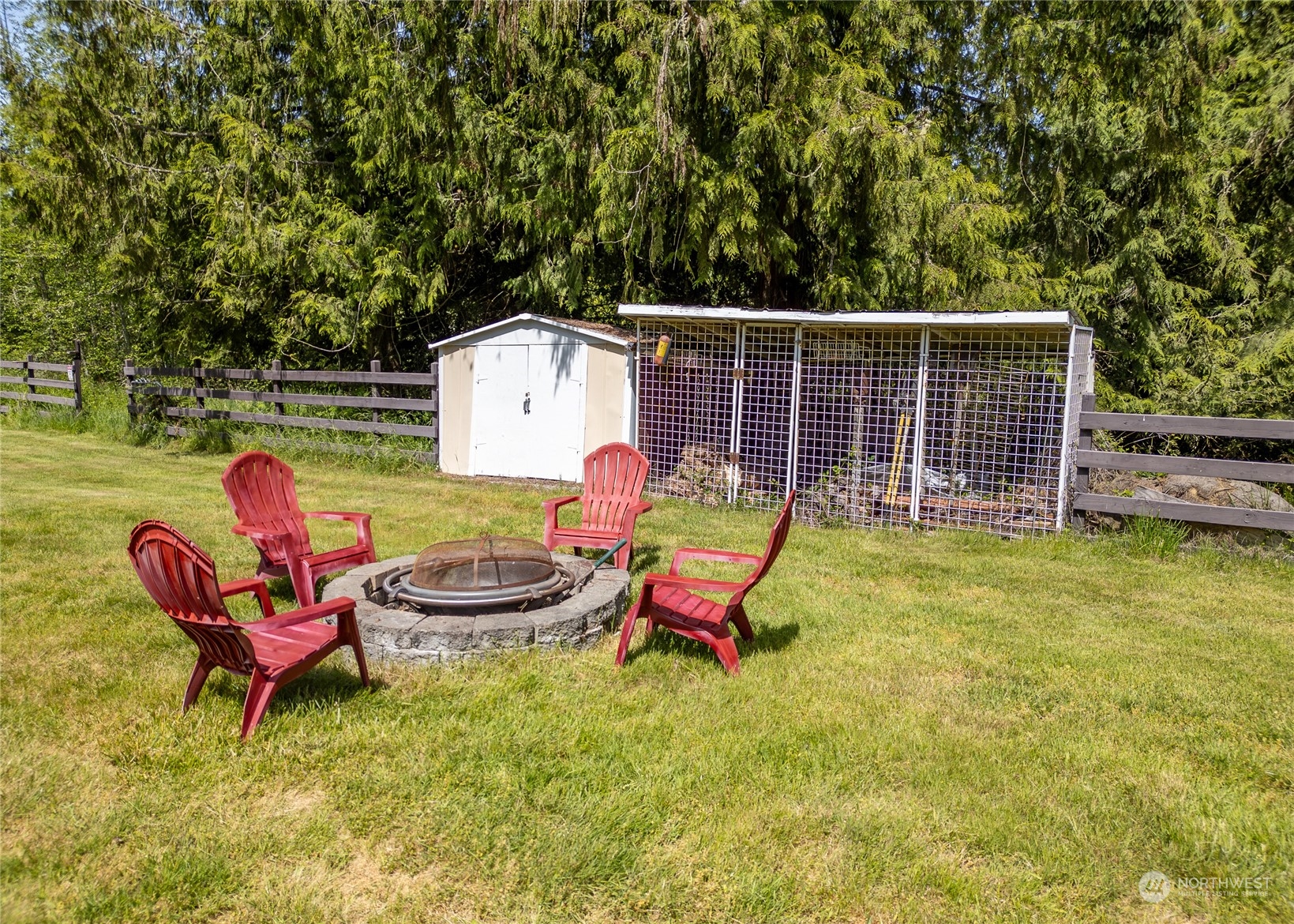 74 Miles Road Port Angeles, WA 98362 - Photo 34 of 40 a backyard of a house with table and chairs