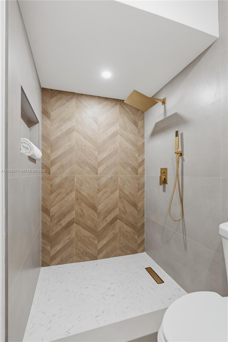 2110 Southwest 15th Street Miami, FL 33145 - Photo 29 of 37 a bathroom with a shower and toilet