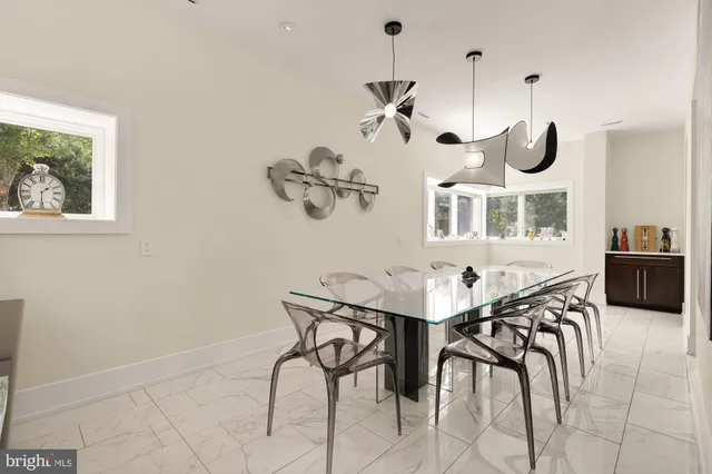 a view of staircase with wooden floor and a potted plant