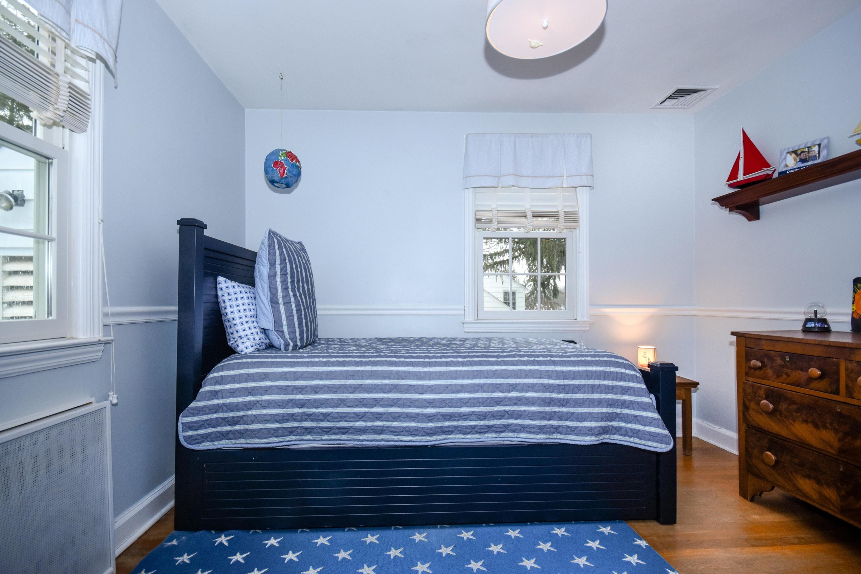 17 Abbey Road Darien, CT 06820 - Photo 17 of 24 a bedroom with a bed and a window