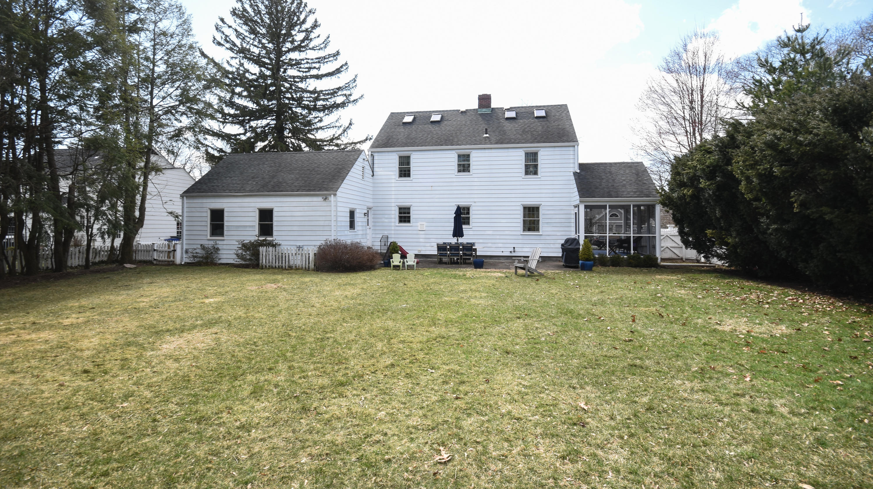 17 Abbey Road Darien, CT 06820 - Photo 23 of 24 a front view of house with yard and trees in the background