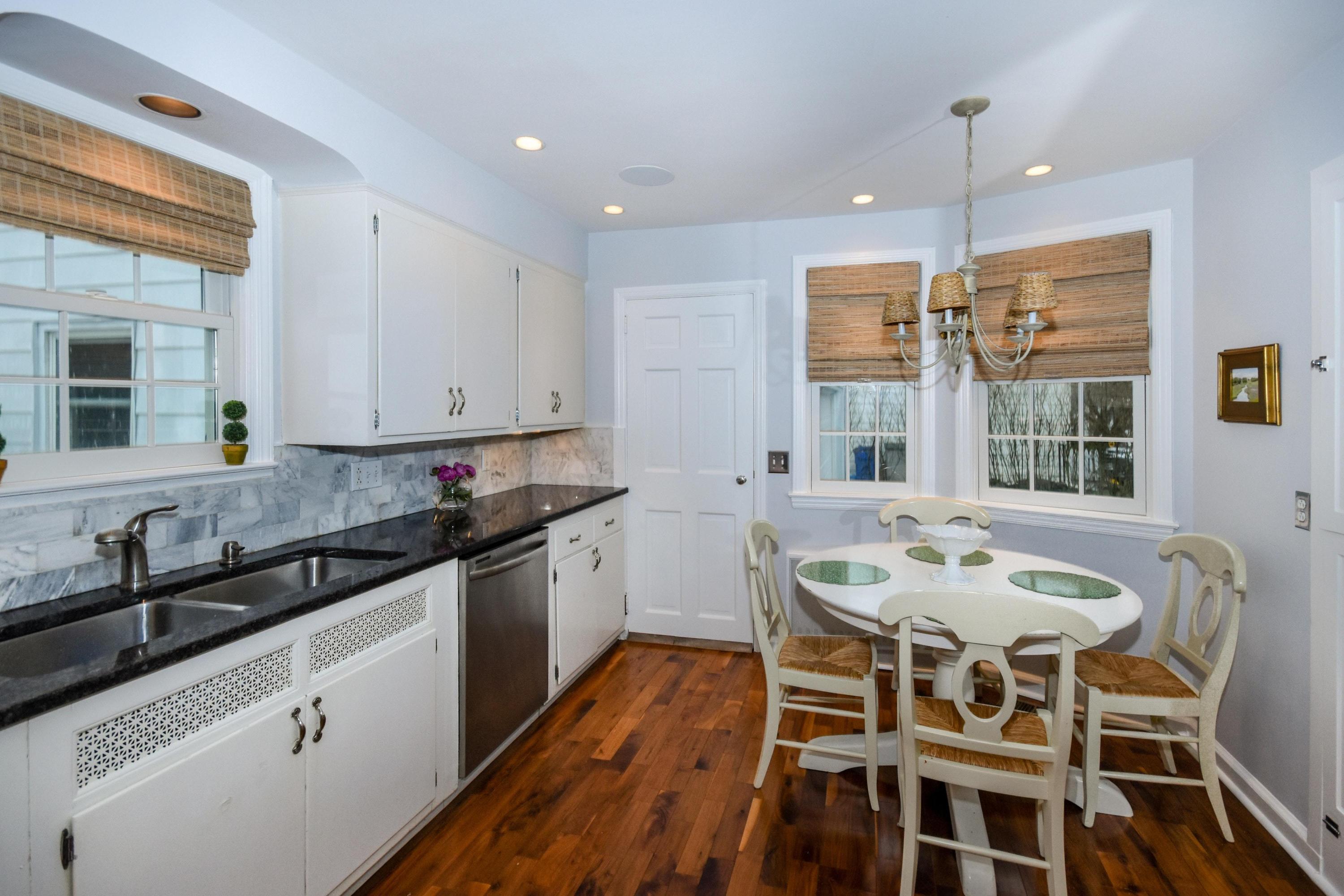 17 Abbey Road Darien, CT 06820 - Photo 9 of 24 a kitchen with stainless steel appliances granite countertop a stove a sink and white cabinets