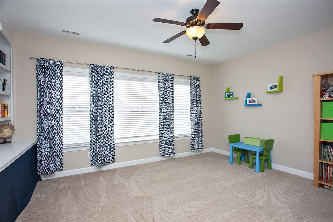 11818 Lowery Ridge Drive Raleigh, NC 27614 - Photo 17 of 25 Upstairs Bonus Room is added space for play, work, exercise...your choice! Bookshelves line the hallway outside bonus room. Bonus Room