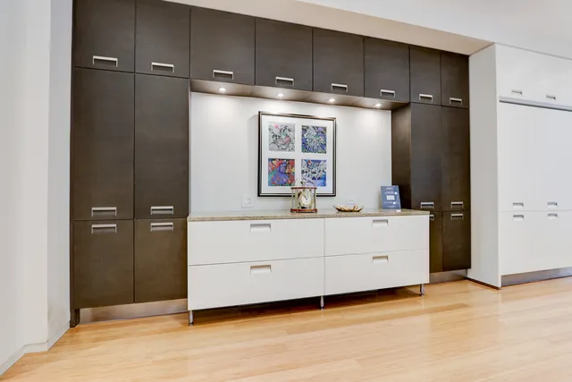 a room with cabinets and wooden floors