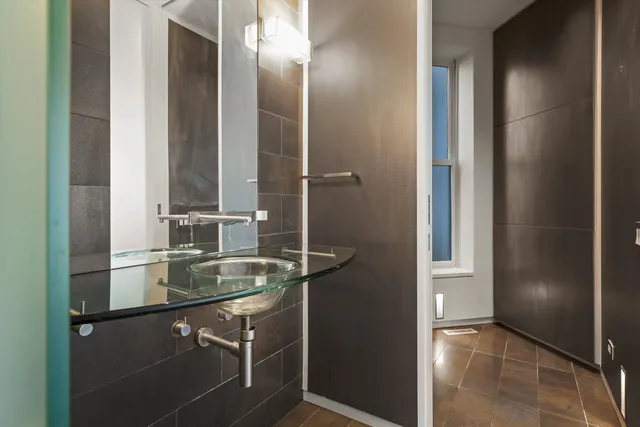 a bathroom with a sink and a mirror