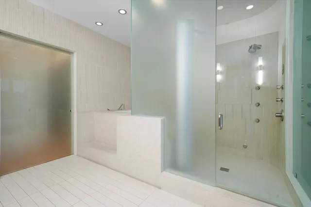 a bathroom with a shower and sink
