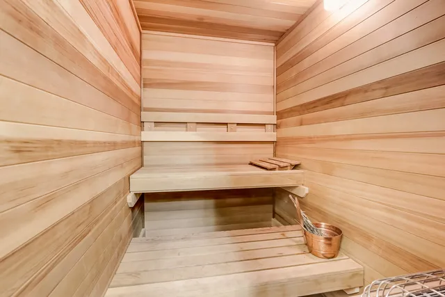 a view of balcony with chairs and potted plants