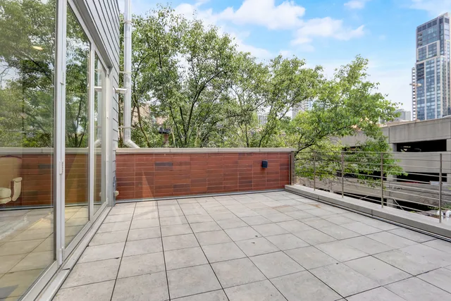 a view of a garden with an outdoor seating