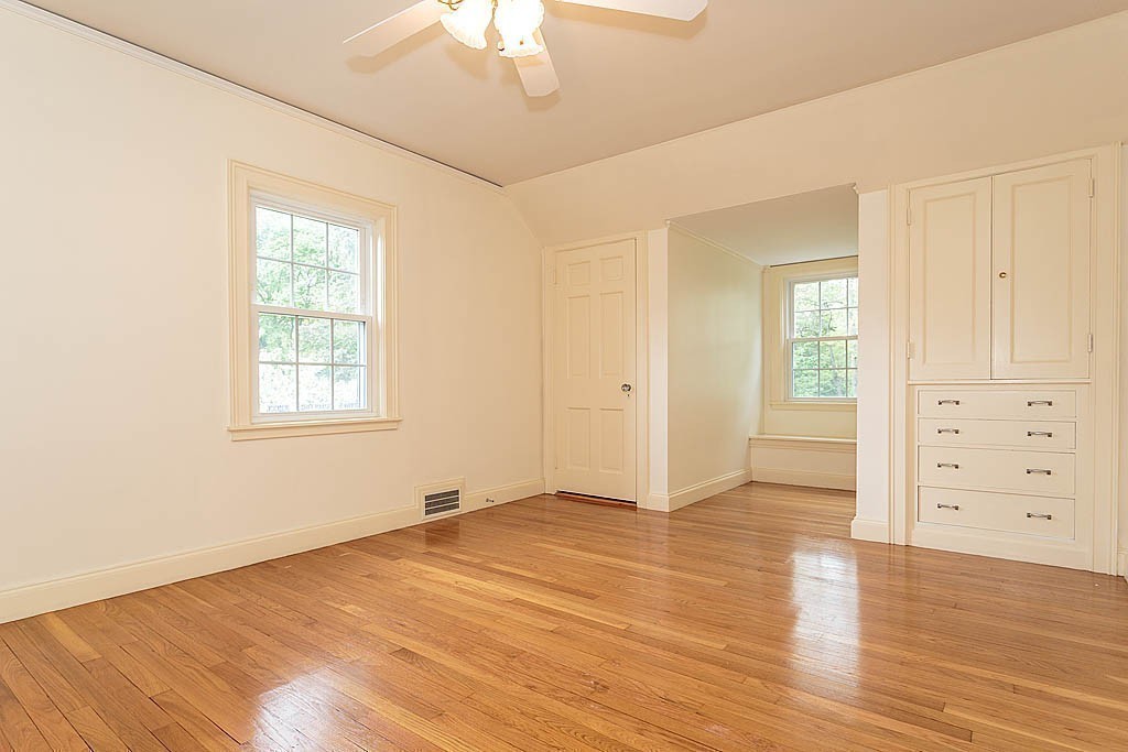 107 Rutledge Road Belmont, MA 02478 - Photo 12 of 16 wooden floor in an empty room with a window