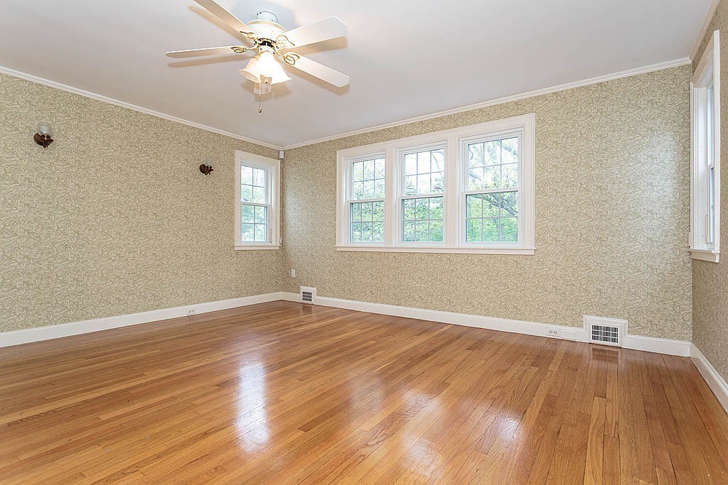 107 Rutledge Road Belmont, MA 02478 - Photo 13 of 16 wooden floor in an empty room with a window