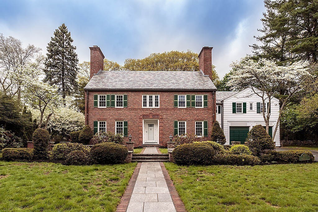107 Rutledge Road Belmont, MA 02478 - Photo 16 of 16 a front view of a house with a garden and plants