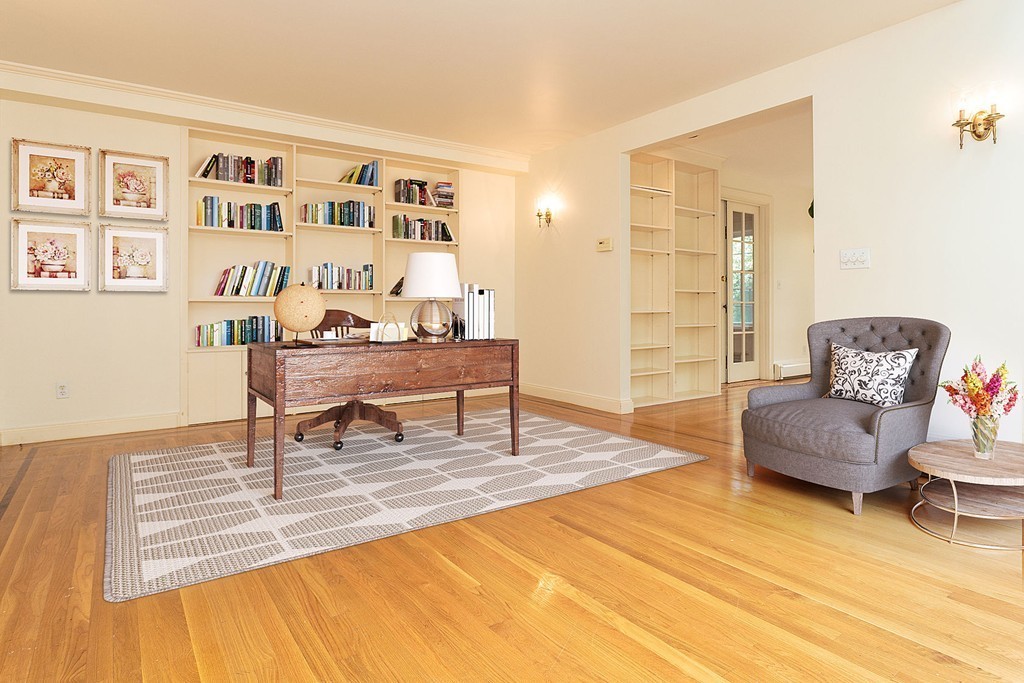 107 Rutledge Road Belmont, MA 02478 - Photo 6 of 16 a living room with furniture and a book shelf