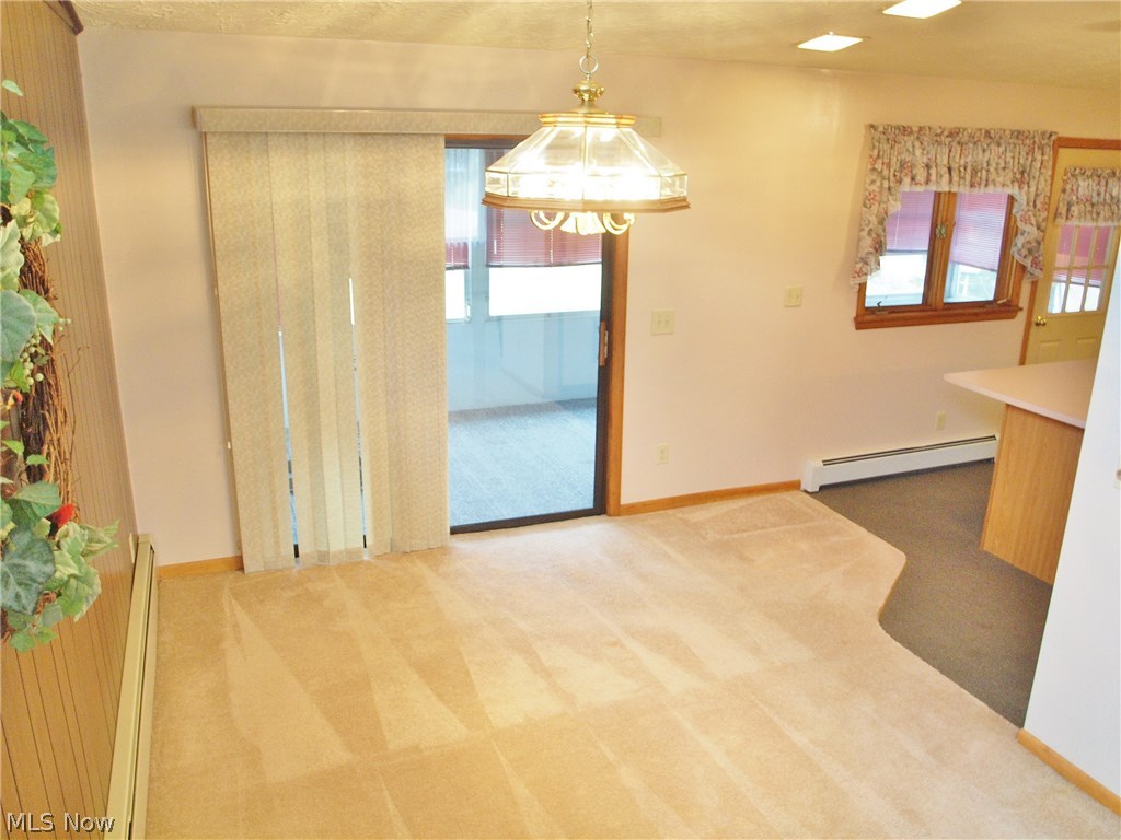2888 Pressler Road Uniontown, OH 44685 - Photo 3 of 26 Dining room with glass sliders to long sun porch