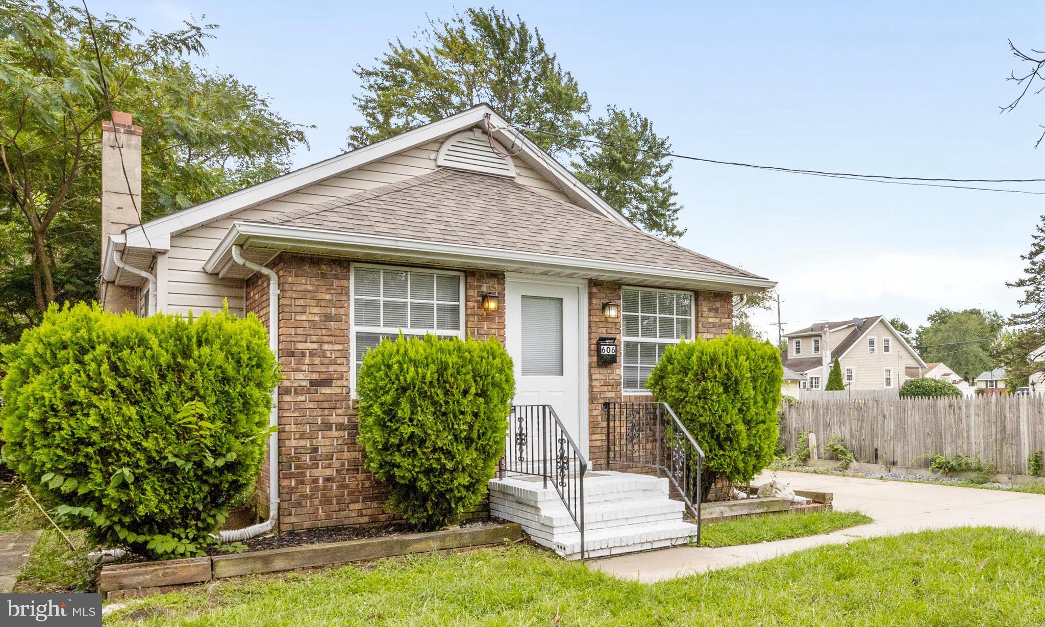 606 4th Street Riverside, NJ 08075 - Photo 1 of 37 a front view of a house with a yard