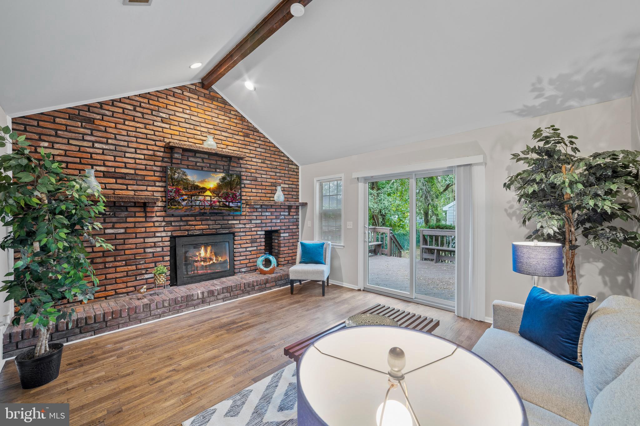 606 4th Street Riverside, NJ 08075 - Photo 3 of 37 a living room with furniture a potted plant and a fireplace