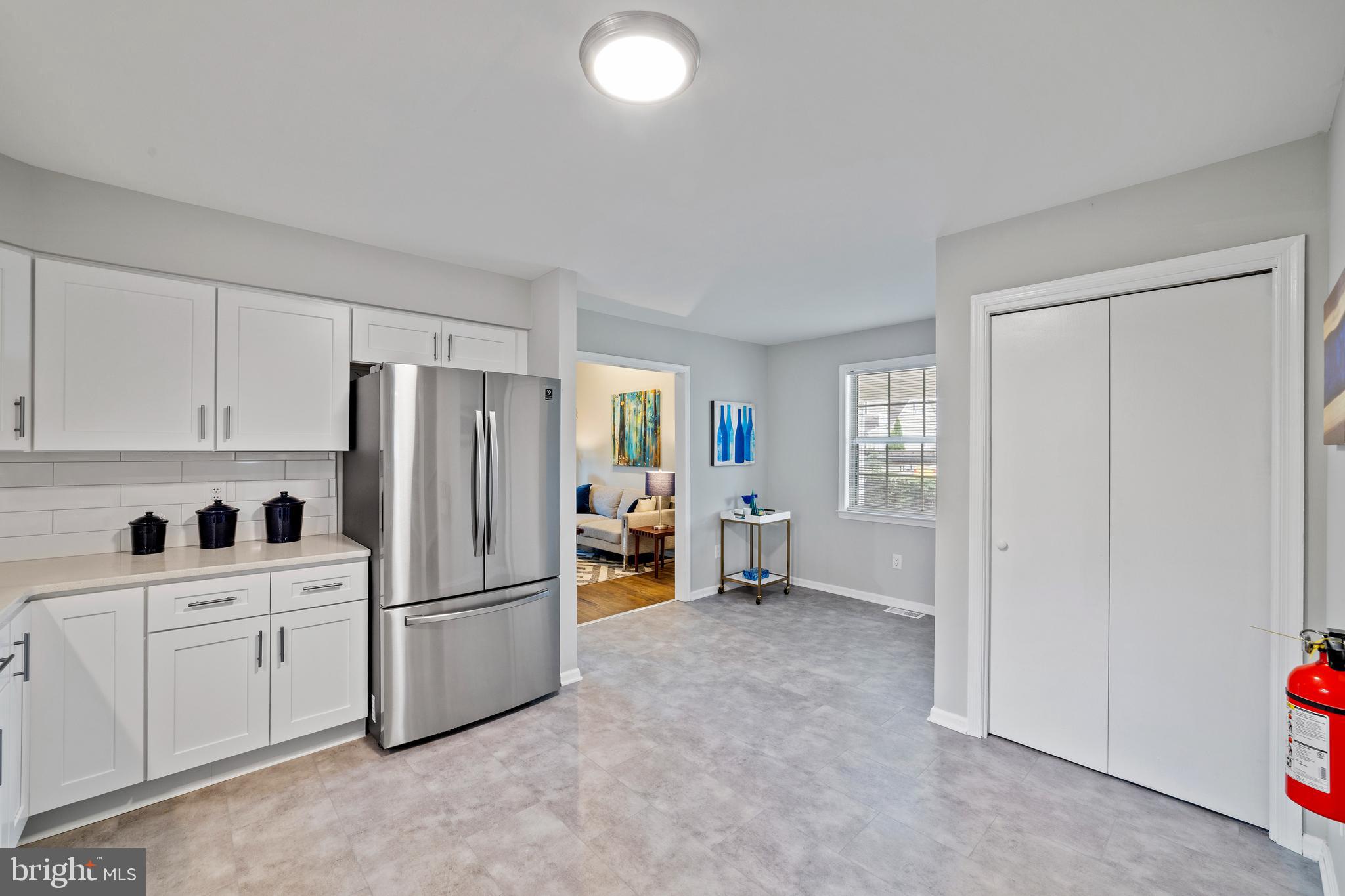 606 4th Street Riverside, NJ 08075 - Photo 7 of 37 a kitchen with stainless steel appliances a refrigerator and cabinets
