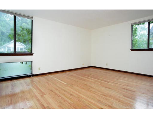 94 Beaconsfield Road, Unit 203 Brookline, MA 02445 - Photo 4 of 5 a view of an empty room and window