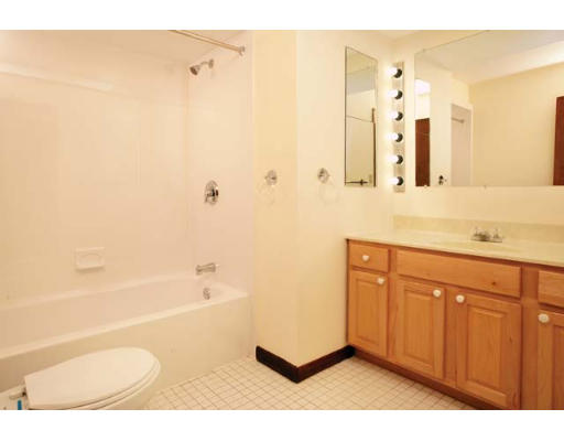 94 Beaconsfield Road, Unit 203 Brookline, MA 02445 - Photo 5 of 5 a bathroom with a granite countertop sink a toilet and shower