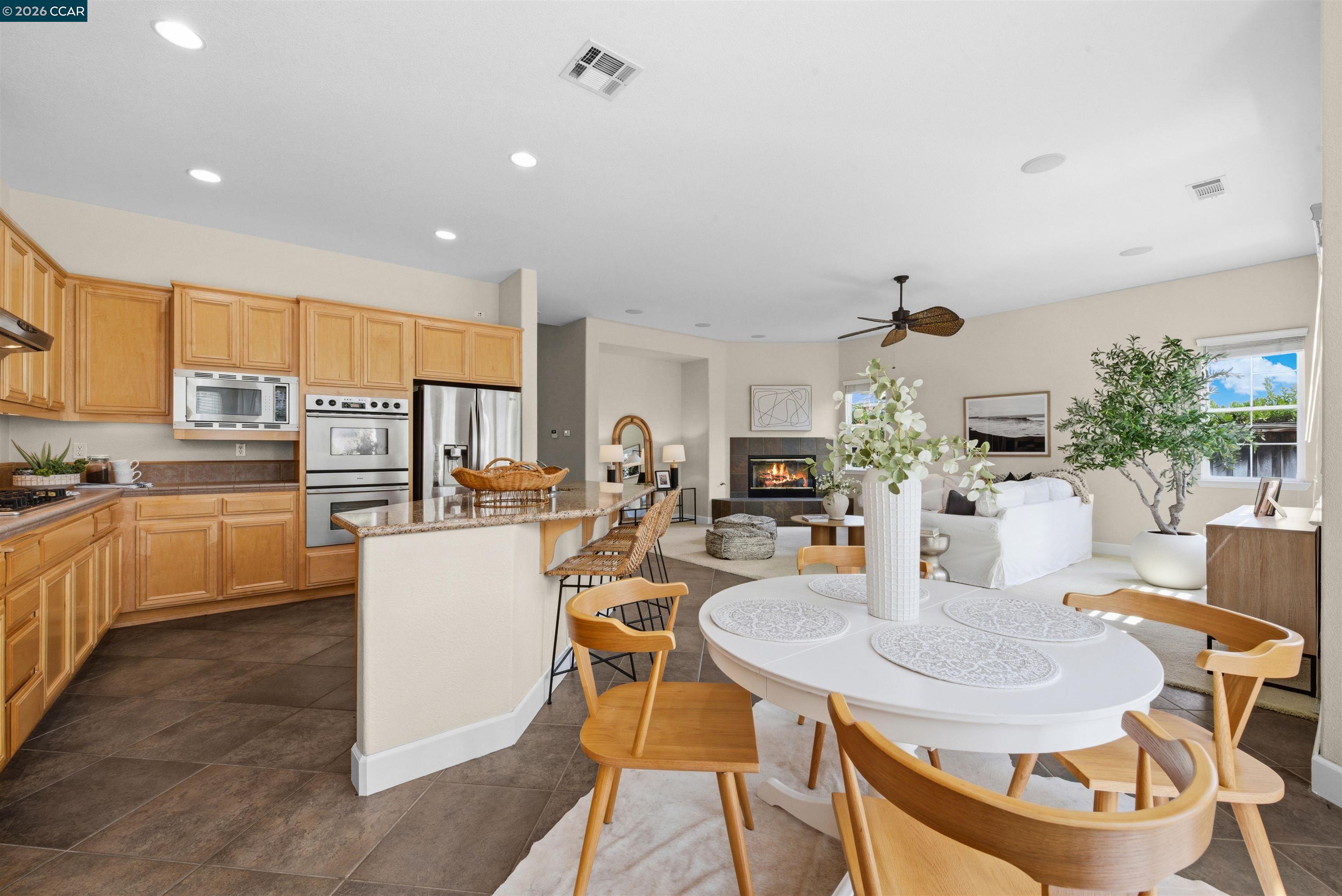 5260 Hiddencrest Court Concord, CA 94521 - Photo 23 of 87 a open dining room with stainless steel appliances kitchen island granite countertop a dining table and chairs