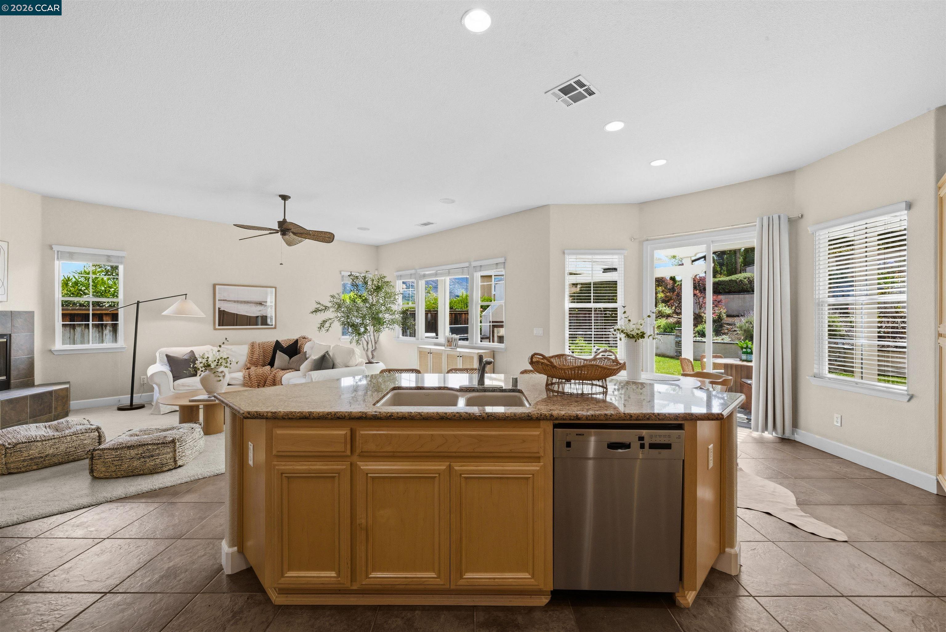 5260 Hiddencrest Court Concord, CA 94521 - Photo 24 of 87 a dining hall with stainless steel appliances granite countertop a sink and a white cabinets