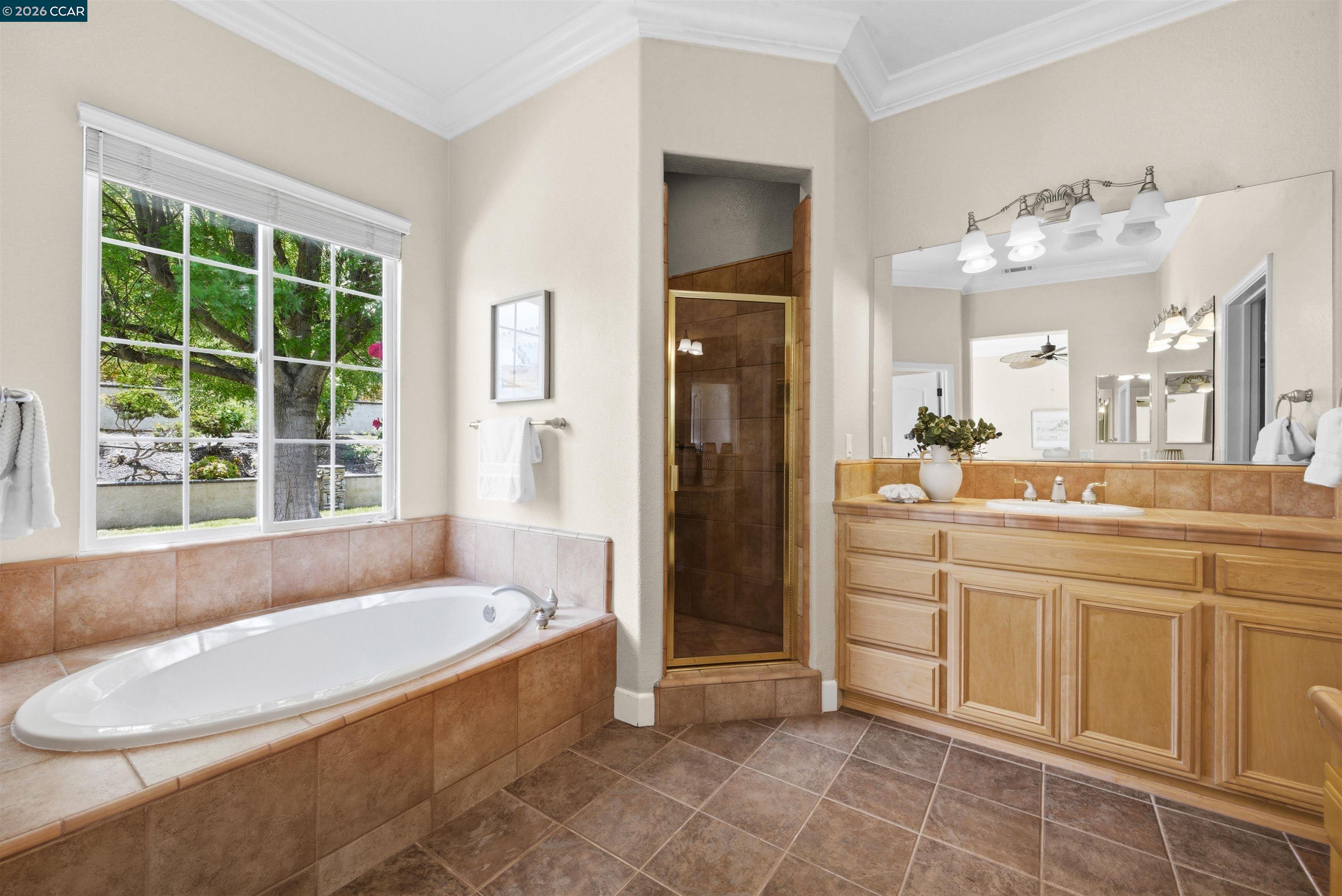 5260 Hiddencrest Court Concord, CA 94521 - Photo 32 of 87 a spacious bathroom with a tub sink and a mirror