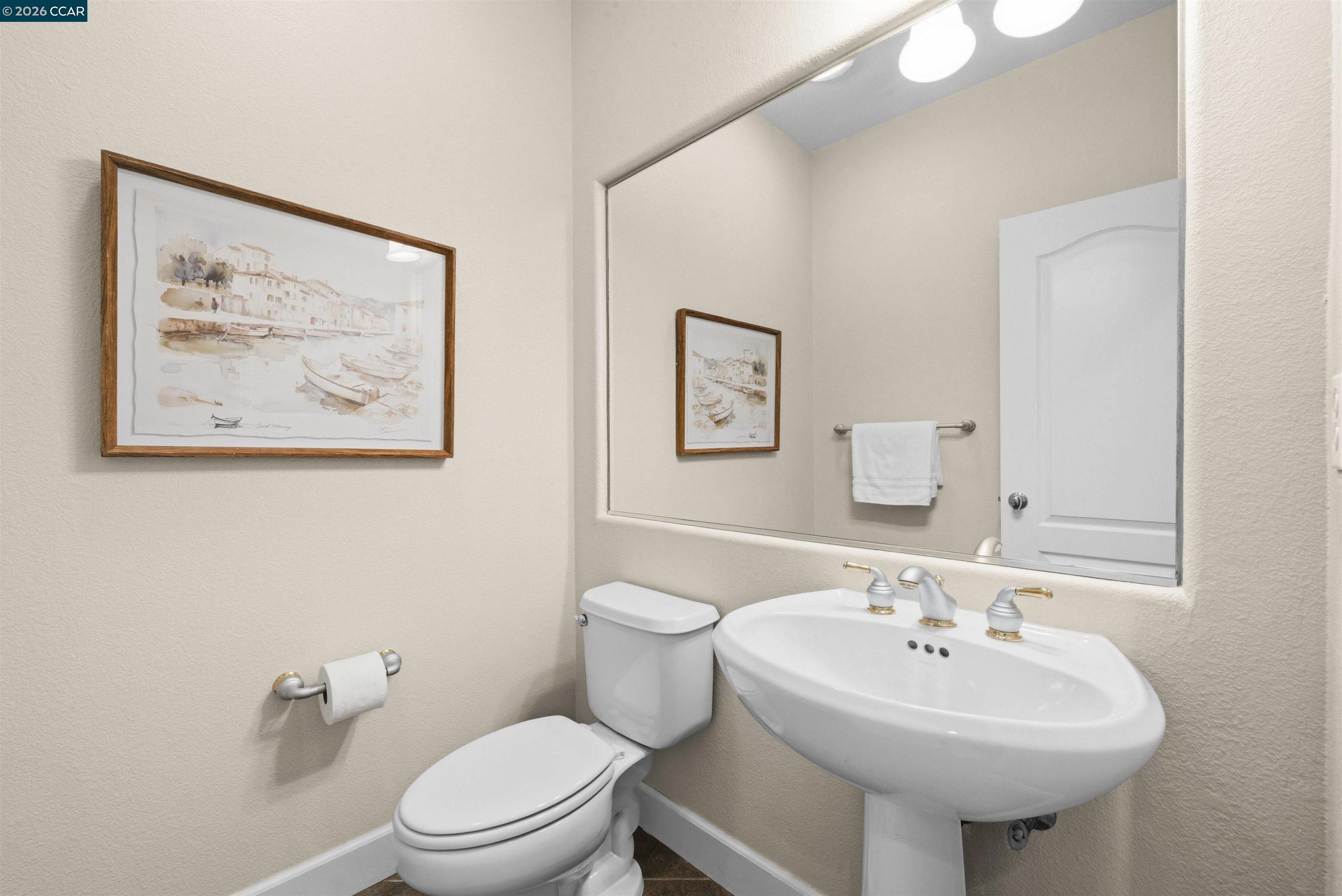 5260 Hiddencrest Court Concord, CA 94521 - Photo 40 of 87 a bathroom with a sink a toilet and a mirror