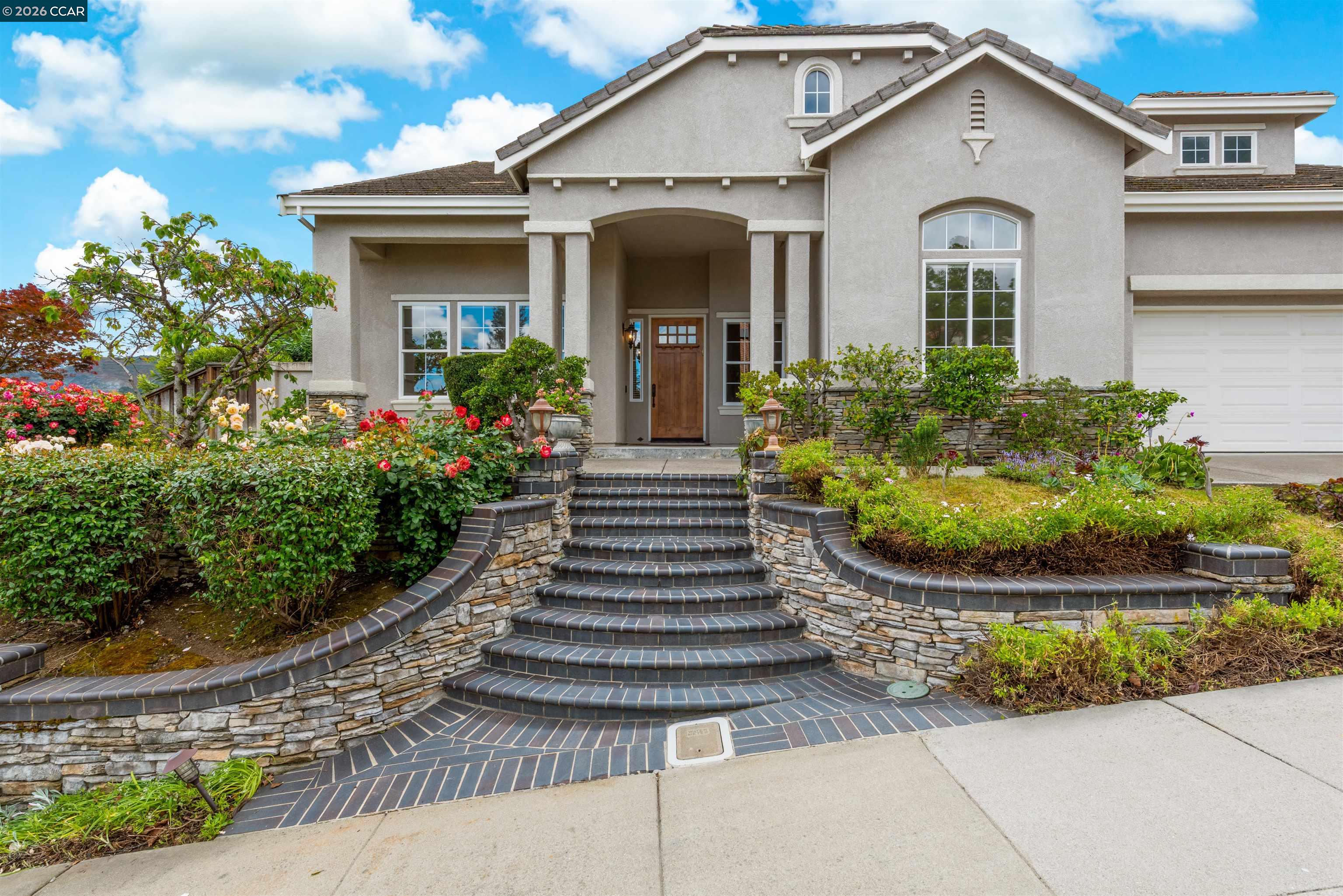 5260 Hiddencrest Court Concord, CA 94521 - Photo 4 of 87 a front view of a house with plants