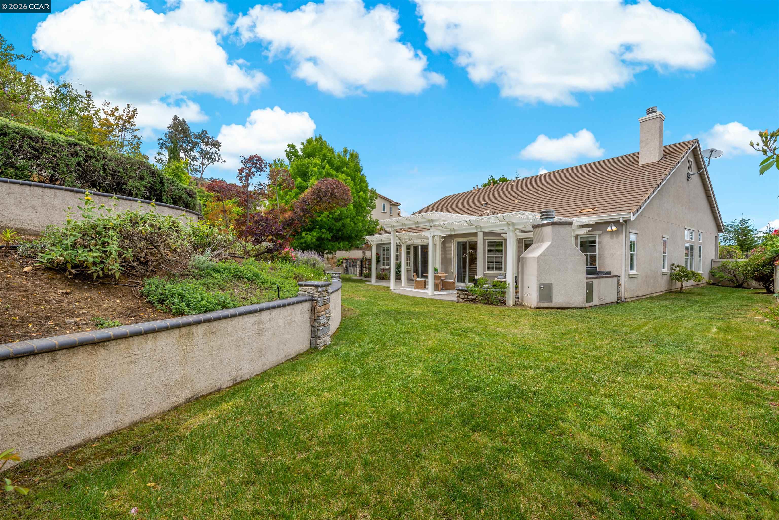 5260 Hiddencrest Court Concord, CA 94521 - Photo 61 of 87 a view of a house with a yard and sitting area