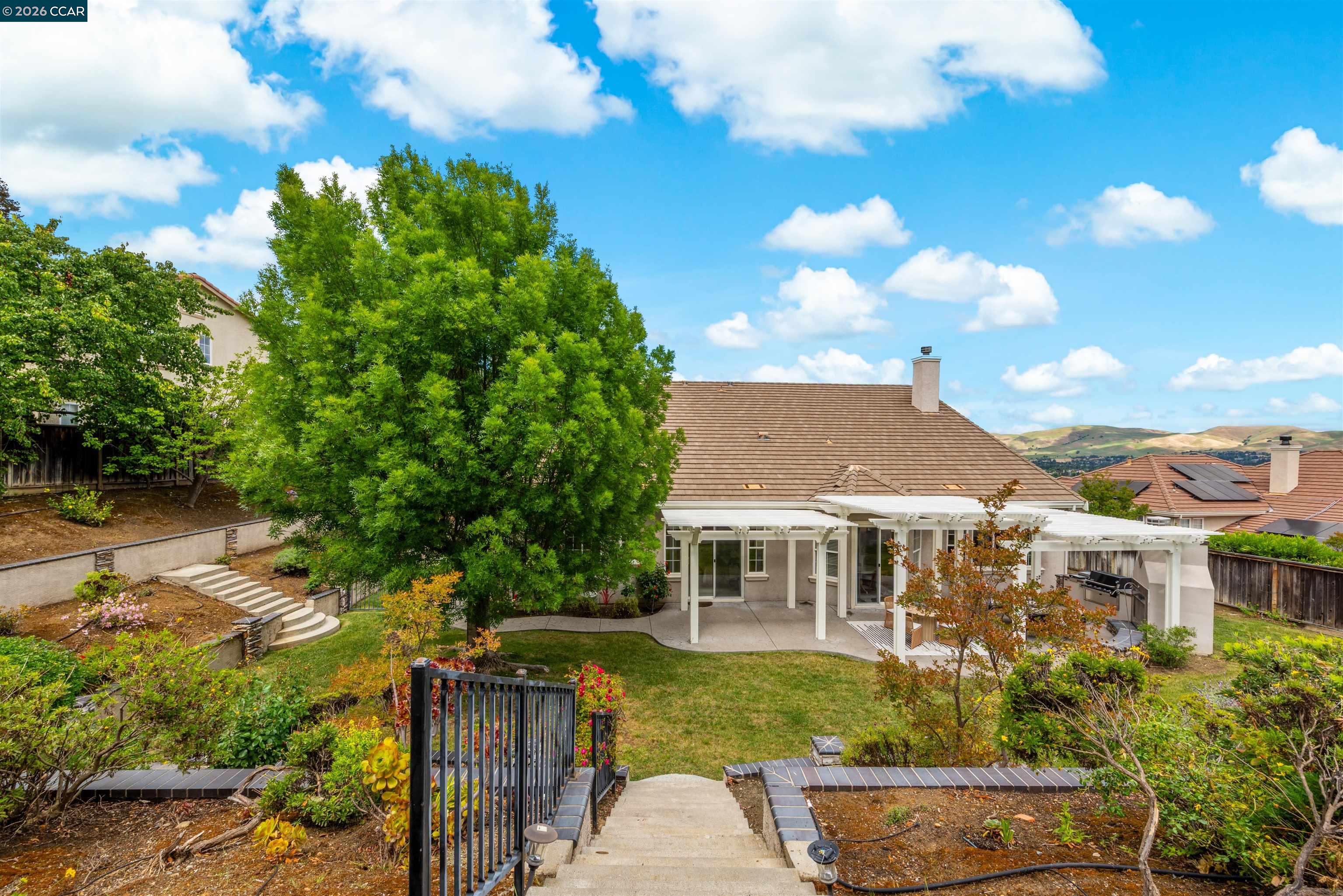 5260 Hiddencrest Court Concord, CA 94521 - Photo 66 of 87 a front view of house with yard and trees in the background