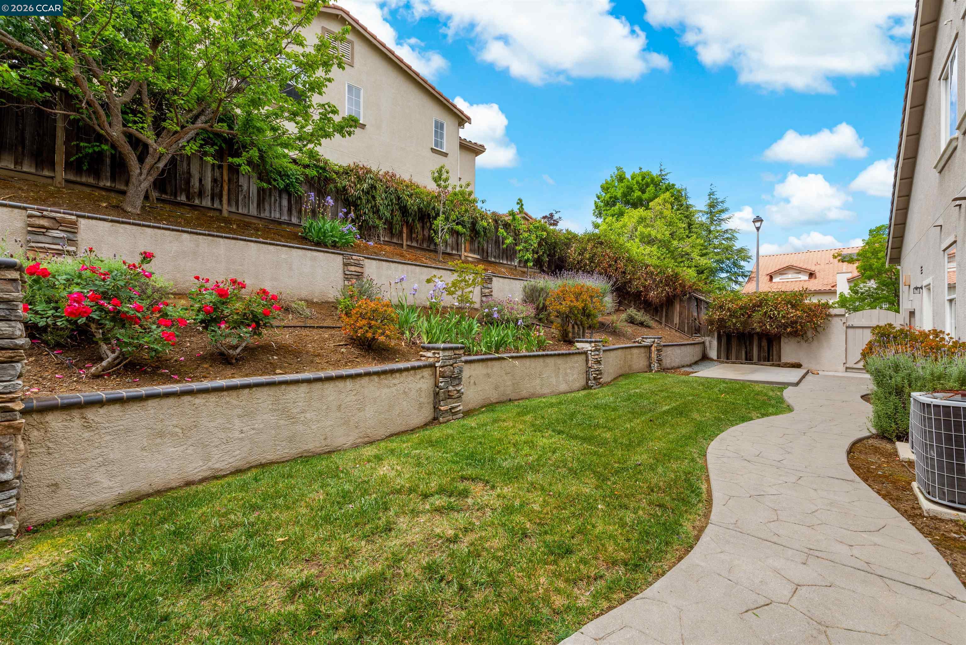 5260 Hiddencrest Court Concord, CA 94521 - Photo 67 of 87 a view of a garden with flowers and trees